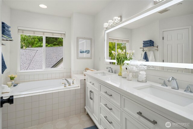 16760 128th Pl NE, Woodinville, WA 98072 - bathroom featuring plenty of natural light, double vanity, and a garden tub