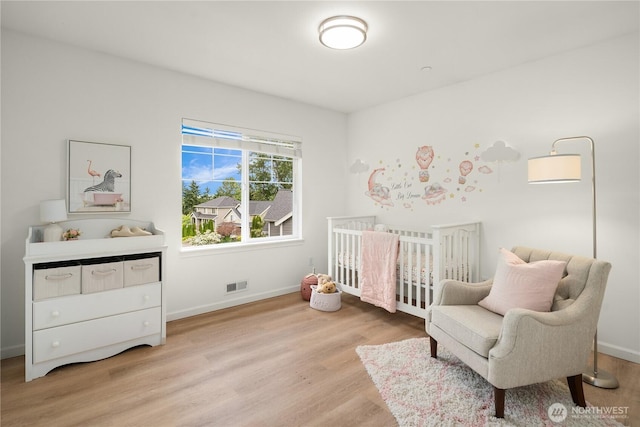 16760 128th Pl NE, Woodinville, WA 98072 - bedroom featuring light wood-type flooring and a nursery area