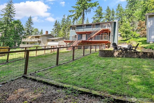 1668 Sapphire Trl, Bellingham, WA 98226 - rear view of house with stairs, a fire pit, a deck, and a fenced backyard