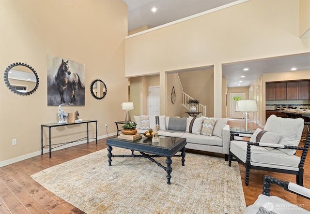 1635 Tannerwood Way SE, North Bend, WA 98045 - living area featuring a high ceiling, light wood-type flooring, stairs, and recessed lighting