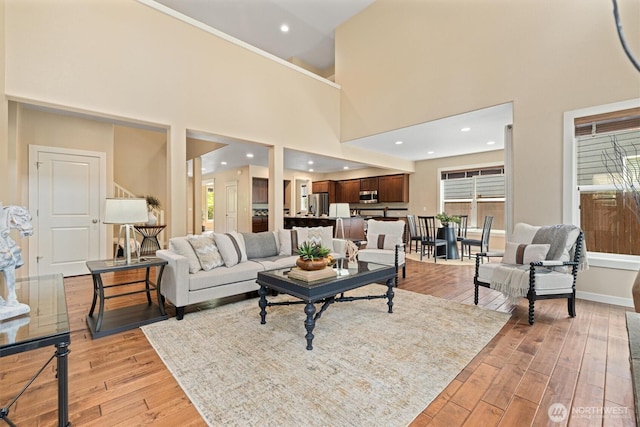 1635 Tannerwood Way SE, North Bend, WA 98045 - living room featuring light wood-style floors and a towering ceiling