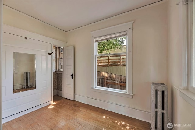 715 W Howe St, Seattle, WA 98119 - spare room with radiator and wood-type flooring