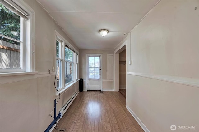 715 W Howe St, Seattle, WA 98119 - entryway featuring wood finished floors and a baseboard radiator
