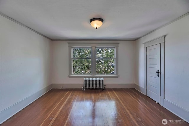 715 W Howe St, Seattle, WA 98119 - spare room with radiator, hardwood / wood-style flooring, and crown molding