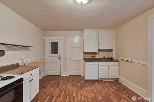 715 W Howe St, Seattle, WA 98119 - kitchen with white dishwasher, wood finished floors, white cabinets, dark countertops, and electric range oven
