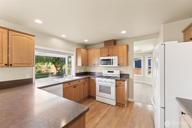456 Sorensen St, Buckley, WA 98321 - kitchen with white appliances, dark countertops, recessed lighting, and light wood-style floors