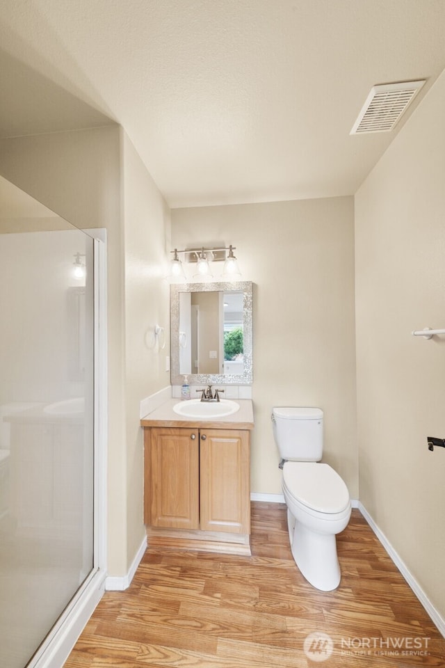 456 Sorensen St, Buckley, WA 98321 - full bathroom with wood finished floors, a shower stall, and vanity