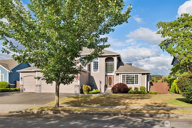 456 Sorensen St, Buckley, WA 98321 - view of front of home featuring asphalt driveway, roof with shingles, an attached garage, and brick siding