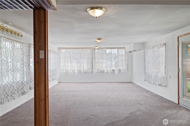 618 Main St, Vader, WA 98593 - spare room featuring carpet and a textured ceiling