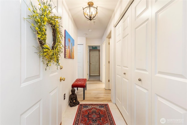 723 114th St SW Unit Y101, Everett, WA 98204 - hallway with a chandelier and light tile patterned floors