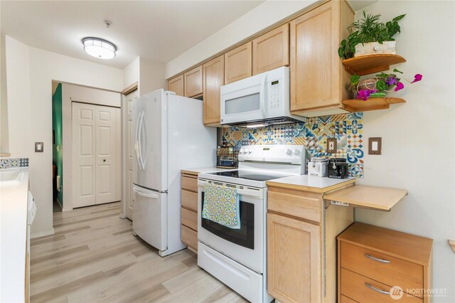 723 114th St SW Unit Y101, Everett, WA 98204 - kitchen with white appliances, light brown cabinetry, light wood-style flooring, and backsplash