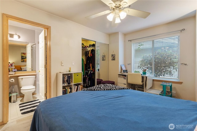 723 114th St SW Unit Y101, Everett, WA 98204 - bedroom featuring ensuite bathroom, wood finished floors, a closet, and a ceiling fan