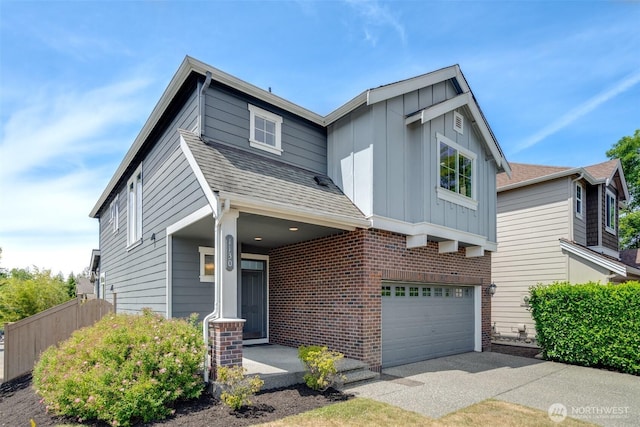 1130 77th Dr SE, Lake Stevens, WA 98258 - traditional-style house featuring board and batten siding, a garage, a shingled roof, and driveway