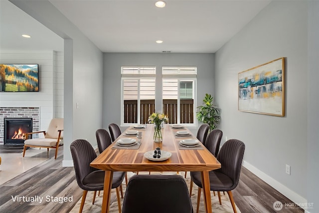 1130 77th Dr SE, Lake Stevens, WA 98258 - dining room with wood finished floors, recessed lighting, and a glass covered fireplace