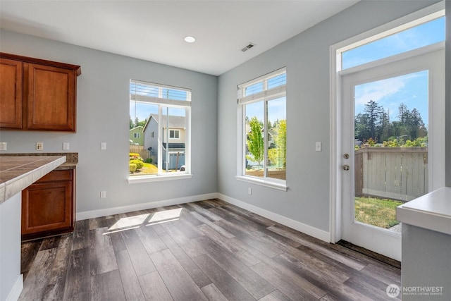 1130 77th Dr SE, Lake Stevens, WA 98258 - unfurnished dining area with dark wood-type flooring and recessed lighting