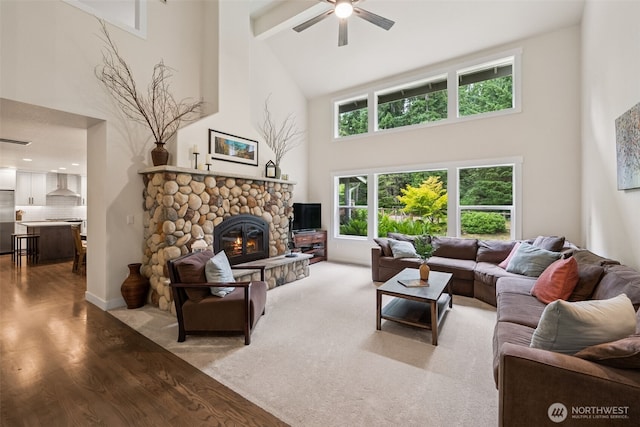6518 73rd Ave E, Olympia, WA 98516 - living room featuring high vaulted ceiling, ceiling fan, a fireplace, and light wood-style flooring