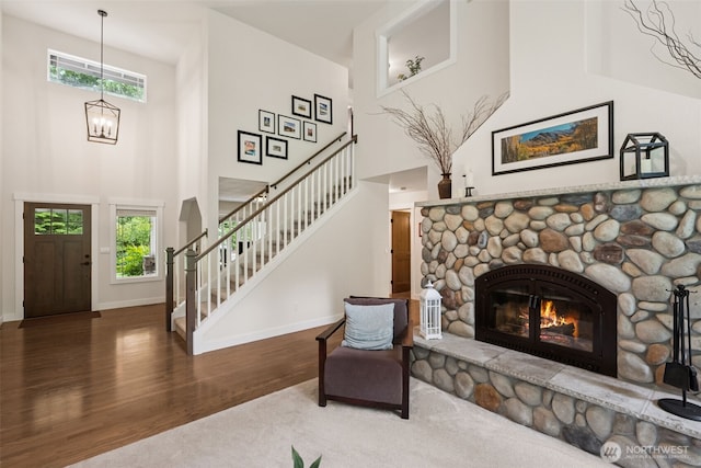 6518 73rd Ave E, Olympia, WA 98516 - foyer with stairs, a towering ceiling, wood finished floors, plenty of natural light, and a chandelier