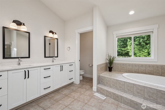 6518 73rd Ave E, Olympia, WA 98516 - bathroom featuring double vanity, a garden tub, tile patterned flooring, and lofted ceiling