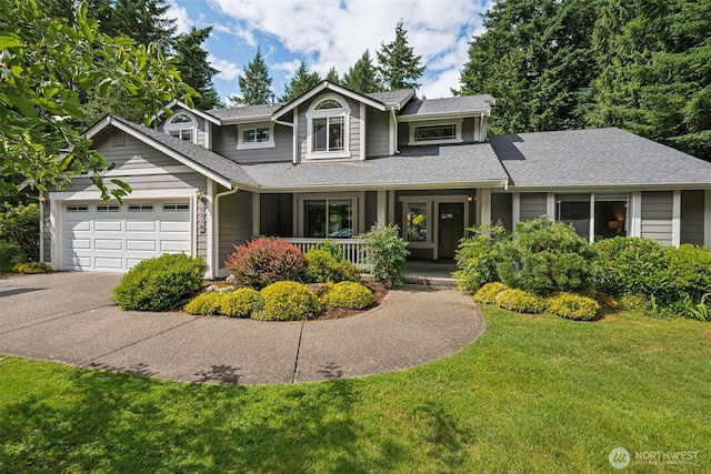 6518 73rd Ave E, Olympia, WA 98516 - view of front of home with a porch, a front yard, a garage, driveway, and a shingled roof