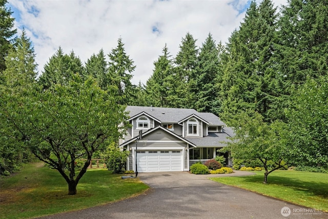 6518 73rd Ave E, Olympia, WA 98516 - traditional-style home featuring driveway, a garage, a front lawn, and a shingled roof