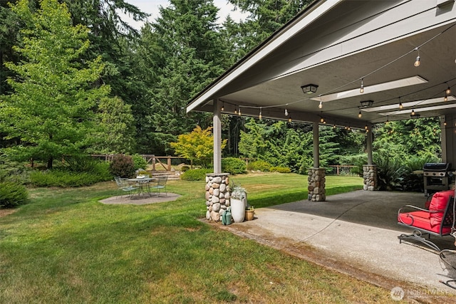 6518 73rd Ave E, Olympia, WA 98516 - view of grassy yard featuring a patio