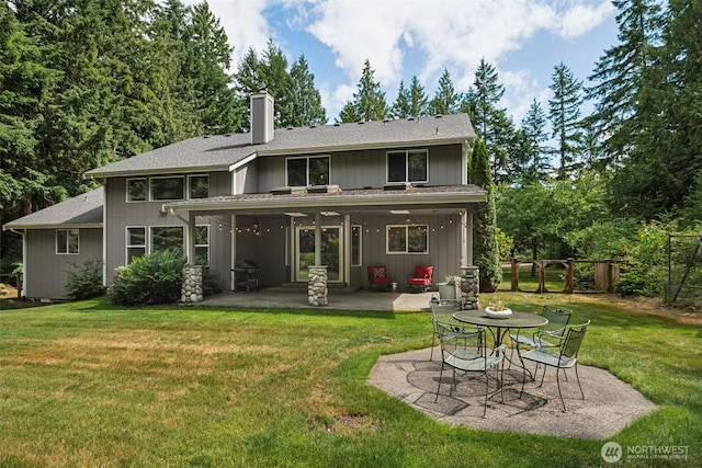 6518 73rd Ave E, Olympia, WA 98516 - back of house with a patio, a chimney, and a shingled roof