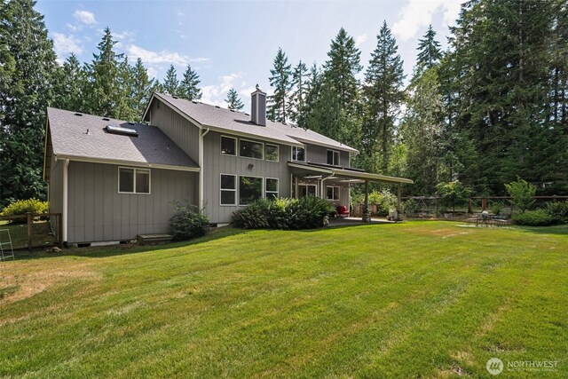 6518 73rd Ave E, Olympia, WA 98516 - back of house with a chimney, a patio area, and roof with shingles
