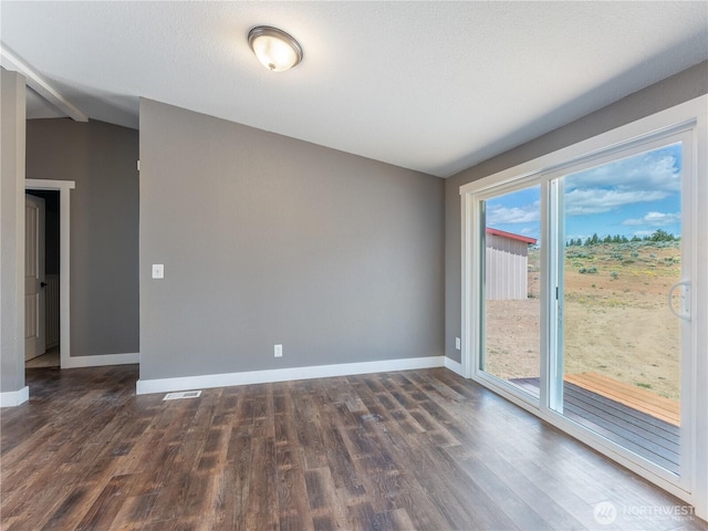 115 Hummingbird Rd, East Wenatchee, WA 98802 - unfurnished room featuring vaulted ceiling and dark wood-style flooring