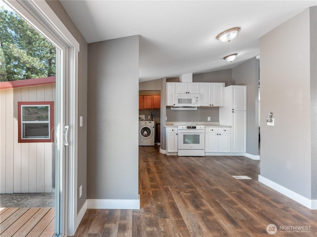 115 Hummingbird Rd, East Wenatchee, WA 98802 - kitchen with white appliances, washer / clothes dryer, white cabinetry, lofted ceiling, and light countertops