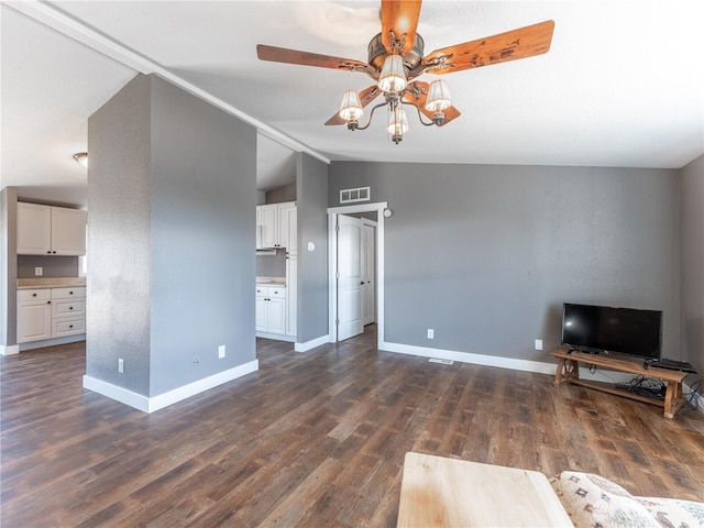 115 Hummingbird Rd, East Wenatchee, WA 98802 - unfurnished living room with vaulted ceiling, ceiling fan, and dark wood-style flooring