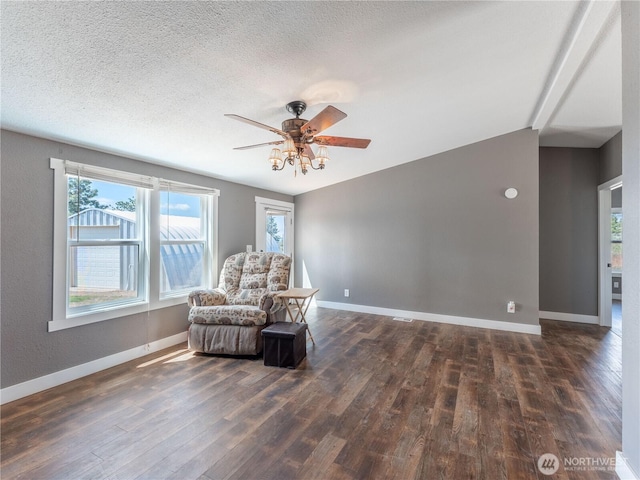 115 Hummingbird Rd, East Wenatchee, WA 98802 - living area with a ceiling fan, wood finished floors, vaulted ceiling, healthy amount of natural light, and a textured ceiling