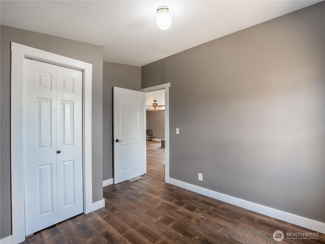 115 Hummingbird Rd, East Wenatchee, WA 98802 - unfurnished bedroom with dark wood-style floors and a closet