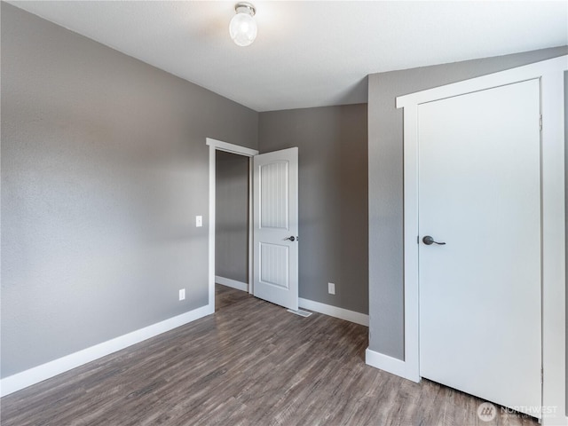 115 Hummingbird Rd, East Wenatchee, WA 98802 - unfurnished bedroom with wood finished floors and baseboards