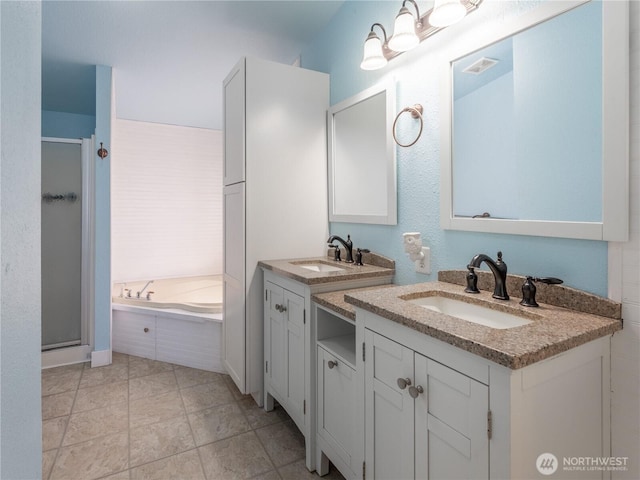 115 Hummingbird Rd, East Wenatchee, WA 98802 - full bathroom with a stall shower, two vanities, and a garden tub