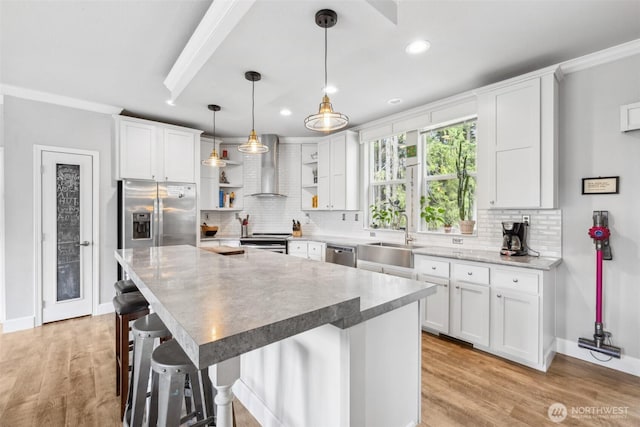 1966 Hooker Rd, Sequim, WA 98382 - kitchen with open shelves, stainless steel appliances, wall chimney range hood, recessed lighting, and decorative backsplash