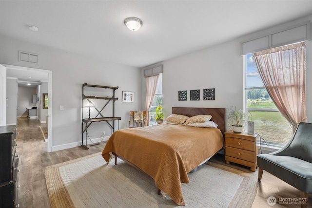 1966 Hooker Rd, Sequim, WA 98382 - bedroom featuring multiple windows and wood finished floors