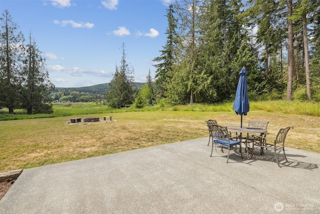 1966 Hooker Rd, Sequim, WA 98382 - view of patio featuring a fire pit and outdoor dining space