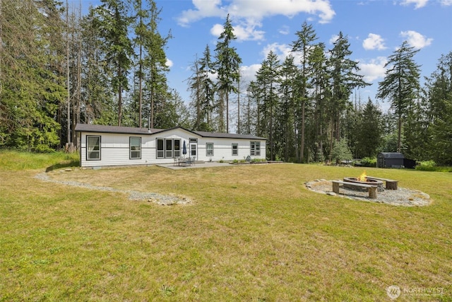1966 Hooker Rd, Sequim, WA 98382 - rear view of house featuring an outdoor fire pit, a patio area, and a yard
