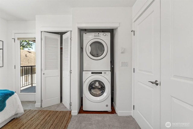 1125 N 93rd St Unit 6, Seattle, WA 98103 - washroom featuring stacked washer / dryer and carpet flooring