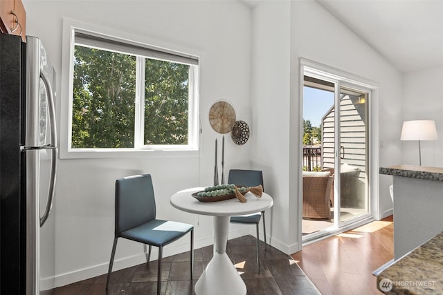 1125 N 93rd St Unit 6, Seattle, WA 98103 - dining space featuring wood finished floors and vaulted ceiling