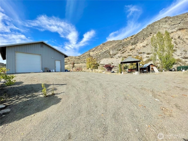 59G Copple Rd, Omak, WA 98841 - view of yard featuring a mountain view, an outbuilding, driveway, and a gazebo