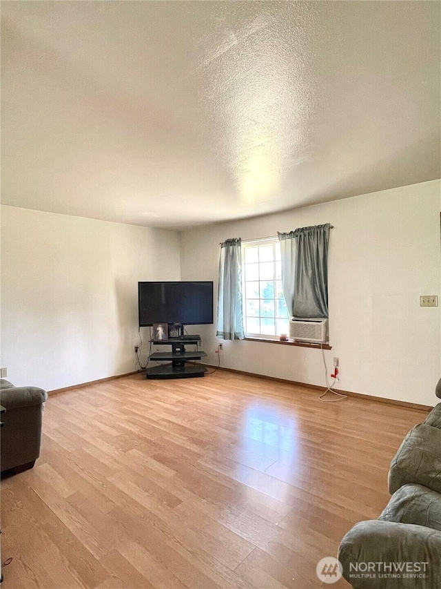 59G Copple Rd, Omak, WA 98841 - living room with wood finished floors, a textured ceiling, and cooling unit