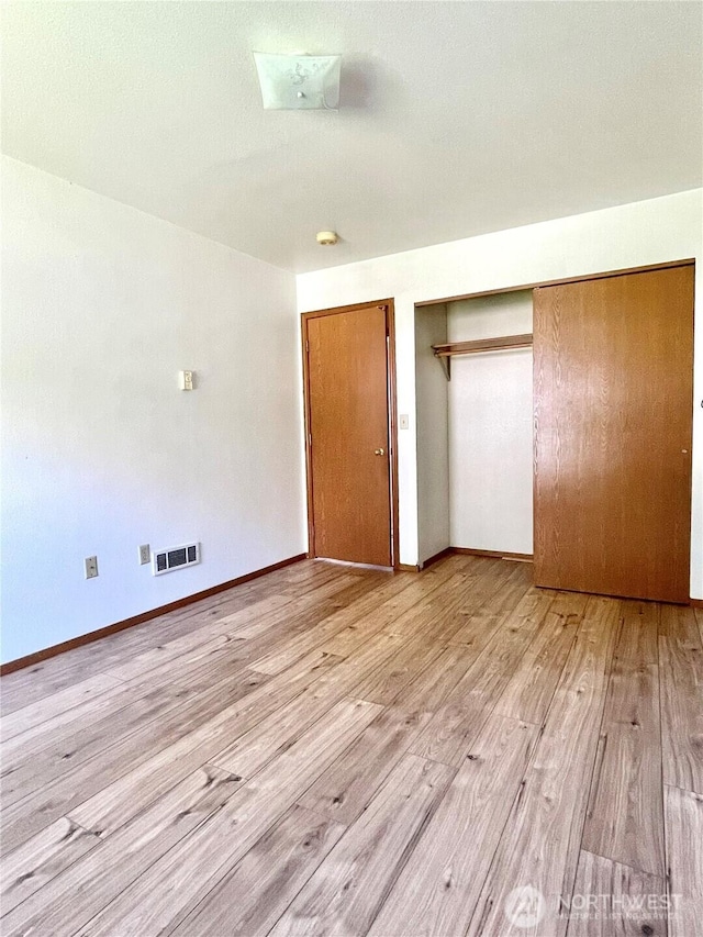 59G Copple Rd, Omak, WA 98841 - unfurnished bedroom featuring light wood-style floors and a closet