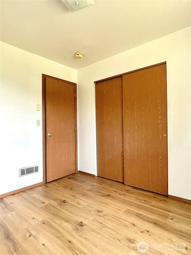 59G Copple Rd, Omak, WA 98841 - unfurnished bedroom featuring light wood-style floors and a closet
