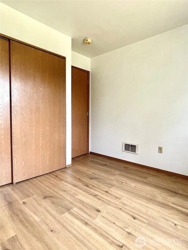 59G Copple Rd, Omak, WA 98841 - unfurnished bedroom featuring wood finished floors and a closet
