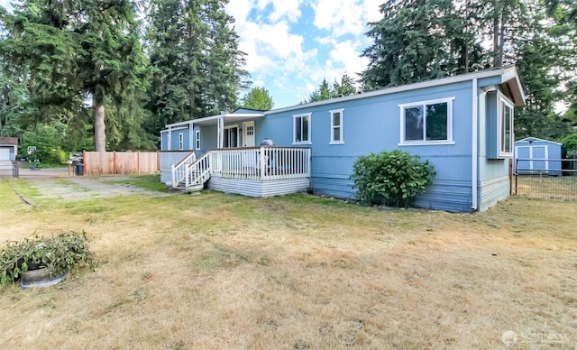 19820 63rd Avenue Ct E, Spanaway, WA 98387 - manufactured / mobile home with covered porch and a shed