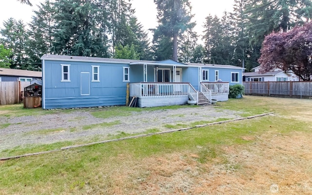 19820 63rd Avenue Ct E, Spanaway, WA 98387 - back of property featuring a deck and view of scattered trees