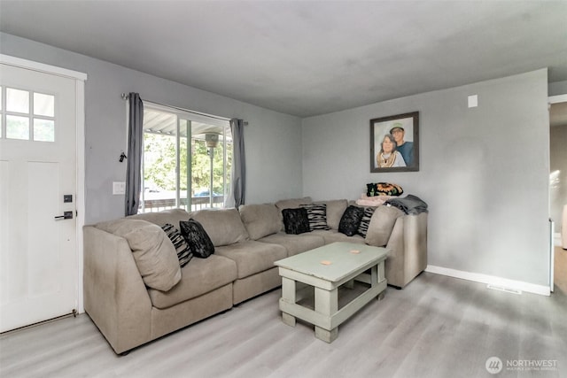 19820 63rd Avenue Ct E, Spanaway, WA 98387 - living room featuring light wood-type flooring and healthy amount of natural light