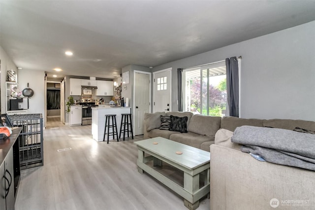 19820 63rd Avenue Ct E, Spanaway, WA 98387 - living room with light wood finished floors and recessed lighting