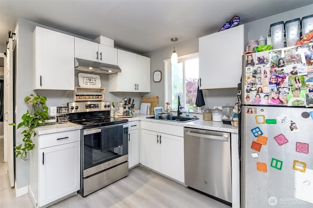 19820 63rd Avenue Ct E, Spanaway, WA 98387 - kitchen with stainless steel appliances, light countertops, and white cabinetry
